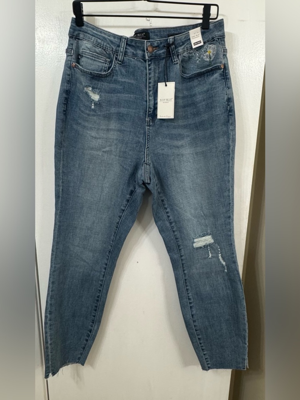 Judy Blue Distressed High Rise skinny Jeans with embroidered flower on Pocket